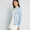 Cardigan de golf brodé en cachemire Cardigan de golf brodé en cachemire