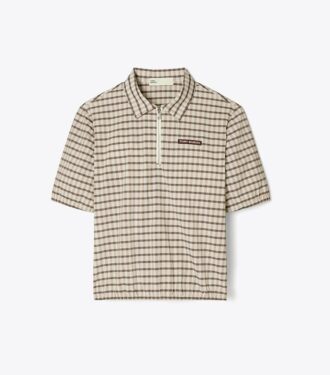 Polo demi-zip teint dans la masse