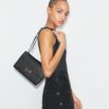 Sac à bandoulière T Monogram Pebbled Sac à bandoulière T Monogram Pebbled